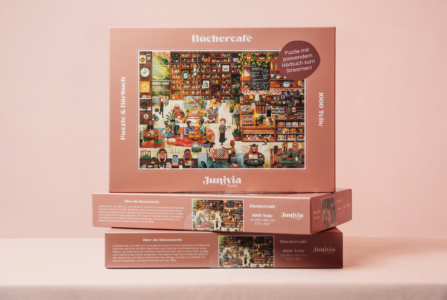 Junivia Büchercafe Puzzle: Gesamtansicht von drei gestapelten Büchercafe Puzzles mit passendem Hörbuch mit Buchladenmotiv und Selbstfindungsgeschichte 