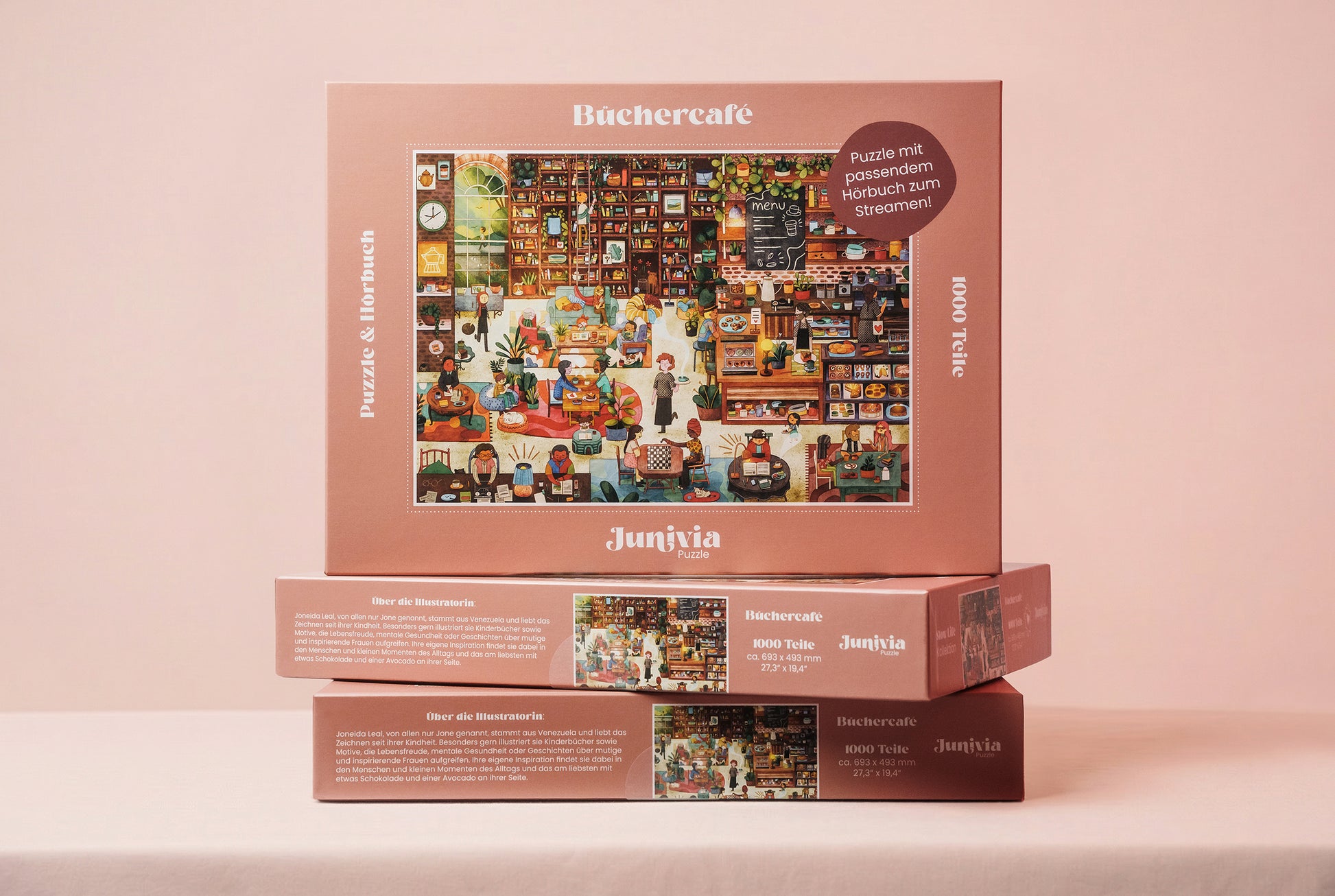 Junivia Büchercafe Puzzle: Gesamtansicht von drei gestapelten Büchercafe Puzzles mit passendem Hörbuch mit Buchladenmotiv und Selbstfindungsgeschichte 